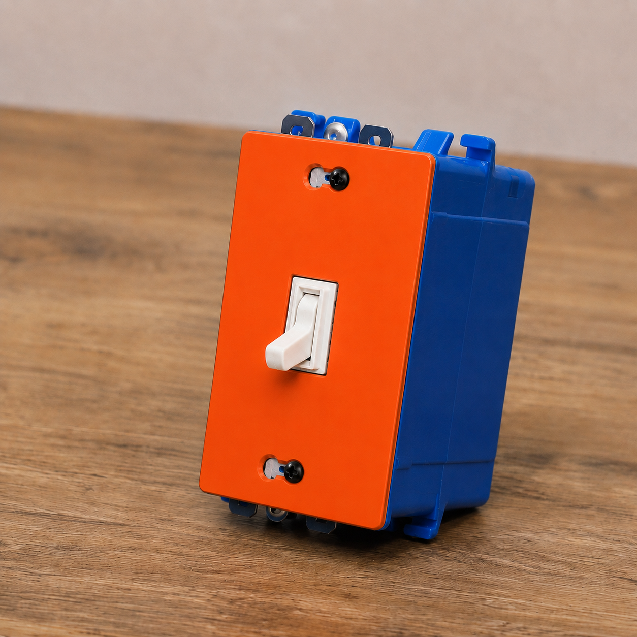 Orange and blue switch panel with a white toggle switch on a wooden surface
