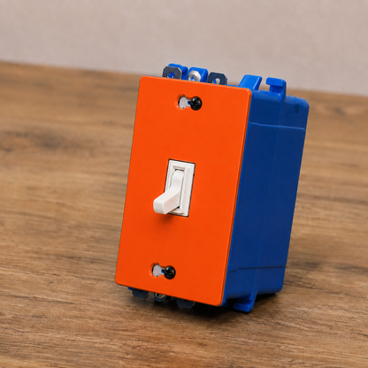 Orange and blue switch panel with a white toggle switch on a wooden surface